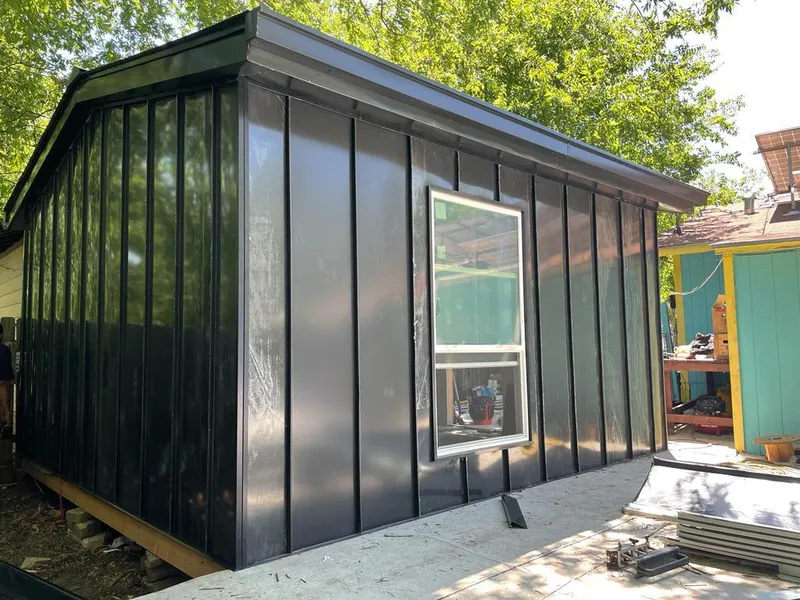 Black standing seam metal wall panels for Roof Inspection in West Pleasant View