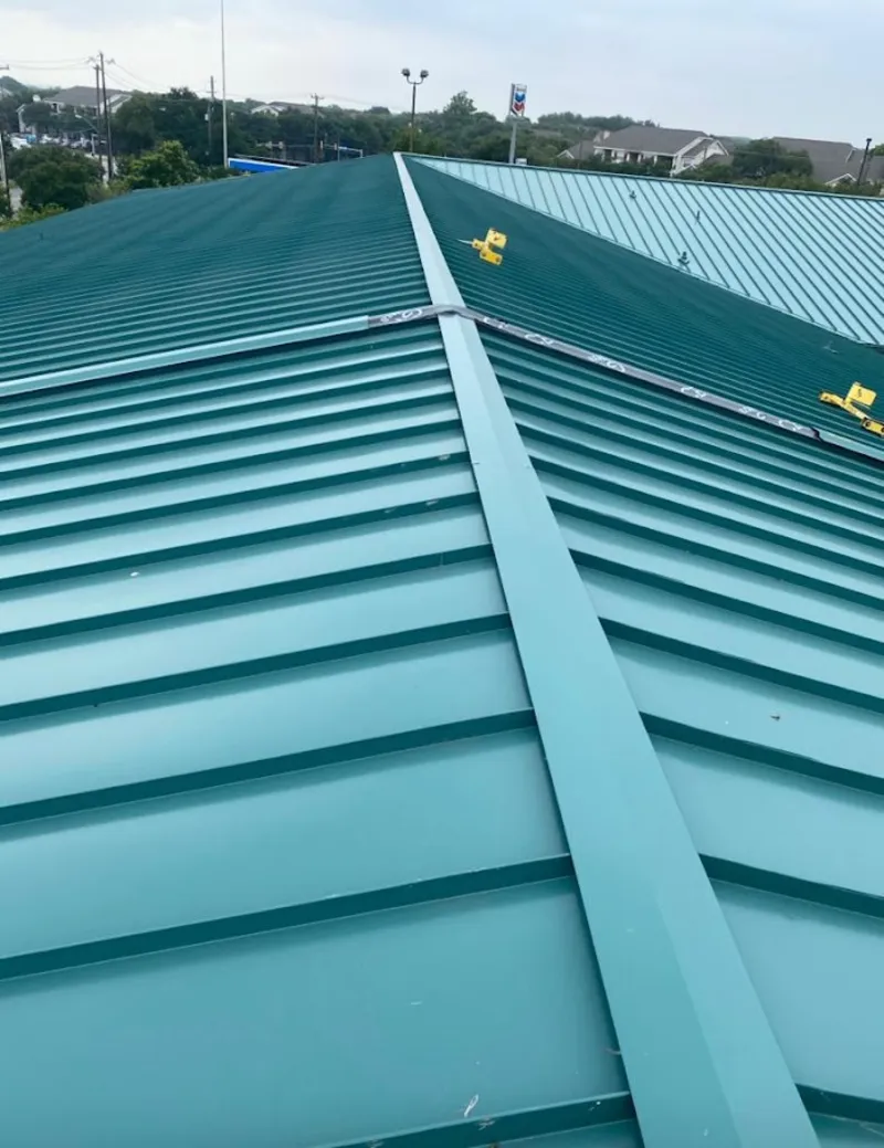 Green commercial metal roof ridge and valley for Metal Roof Repair in West Pleasant View